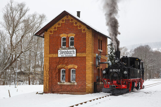 Pressnitztalbahn steam train locomotive railway in winter in Steinbach, Germany