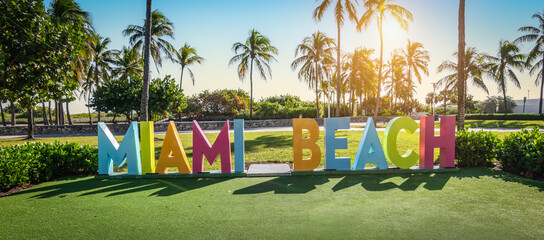 Colorful Miami beach sign in Lummus park at sunset, Miami, Florida.