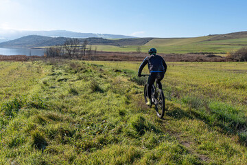 Obraz premium Mountain bike route through the green meadows