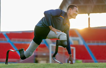 Close up sport man athlete prosthesis legs stay in the position of start running and look forward...