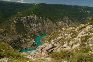 Fototapeta na wymiar Deep canyon, view from the top of the winding river with azure water