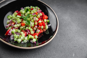 salad vegetable cucumber, tomato onion fresh vegetables appetizer ready to eat healthy eating cooking appetizer meal food snack on the table copy space food background rustic 