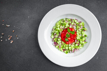salad vegetable cucumber, tomato onion fresh vegetables appetizer ready to eat healthy eating cooking appetizer meal food snack on the table copy space food background rustic 
