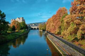 Fototapeta na wymiar Old bridge over the river in autumn