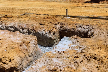 From excavation an earthen trench to pouring of concrete, earthworks are required