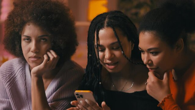 Three African American women discuss celebrity news and gossip on social media
