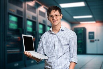 Smiling positive business man with laptop in hands