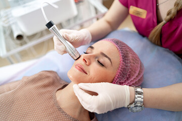 Obraz na płótnie Canvas Dermatology therapy beautician. Professional cosmetology procedure.