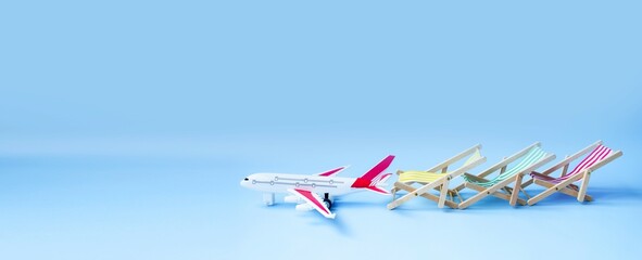 A banner on a blue background, a tourist plane behind it, beach chairs.  Concept of air flights to warm countries, tourism, travel.  Space for copying text.
