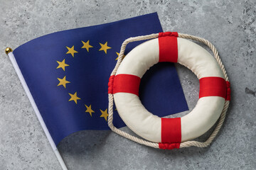 European Union flag and lifebuoy on an abstract concrete background, concept on the theme of assistance from the European Union
