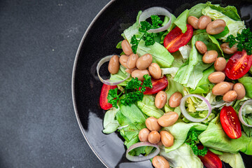 white bean salad green lettuce, tomato healthy eating cooking appetizer meal food snack on the...