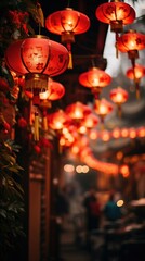 Obraz na płótnie Canvas This photo captures the beauty of red lanterns with golden tassels illuminating a street creating a path that invites one into the heart of traditional festivities. The soft focus in the background