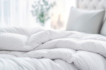 Bed with a white duvet and pillows, inviting to rest.