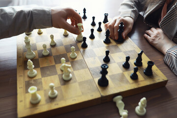 Hand playing game of chess, competition, strategy, battle, play