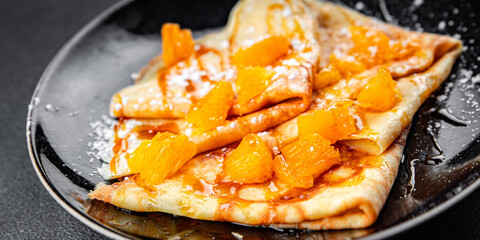 sweet pancake crepe orange syrup fresh eating cooking appetizer meal food snack on the table copy space food background rustic top view