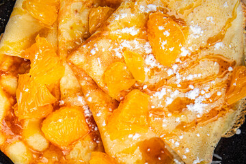 sweet pancake crepe orange syrup fresh eating cooking appetizer meal food snack on the table copy space food background rustic top view