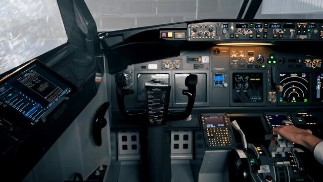 Close-up view of airplane control panel in cockpit with control panel and steering wheel in flight simulator