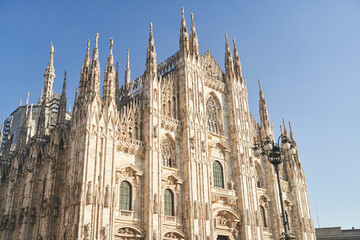 Fototapeta premium Milan, Italy - February 15, 2023: Milan Cathedral in Piazza Duomo during the day, Milan. Cathedral of the Duomo.