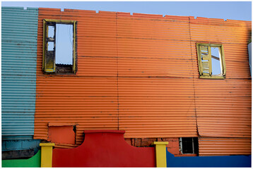 Striking colors of an old house structure with zinc walls. 