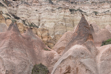 eroded, cone-shaped volcanic rocks in Zelve Valley, Capapdocia, Turkey