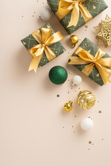 Lavishness and holiday inspiration captured. Top-view vertical photo of presents, luxurious...