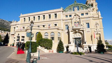 Fototapeta premium Stunning summer view of Monaco's iconic buildings next to the casino. Architectural elegance meets vibrant summer life, capturing the essence of luxury and charm in this Mediterranean gem.