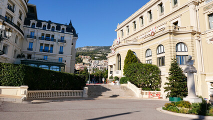 Obraz premium Stunning summer view of Monaco's iconic buildings next to the casino. Architectural elegance meets vibrant summer life, capturing the essence of luxury and charm in this Mediterranean gem.