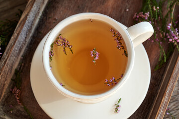 Heather tea in a white cup
