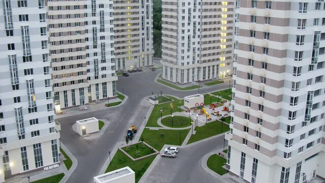 Street between the modern houses at evening, time lapse