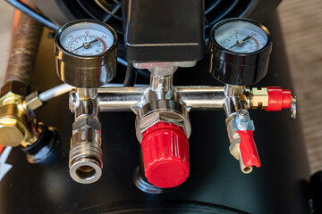 Pressure gauges, pressure measuring couplings in air compressor , measuring instrument on pneumatic control system. Pressure differential gauge