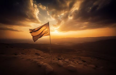 Fotobehang Tattered flag waving in the wind on a mountain overlooking a desert © Jason