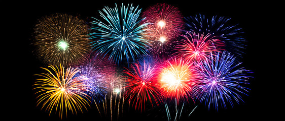 Naklejka premium Fireworks in the sky. Sparkling Countdown, Explosive Fireworks Light Up the Night in a Spectacular New Year's Eve Display.