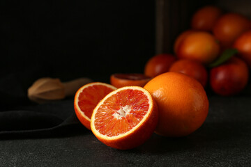 Tasty blood orange fruits on dark background