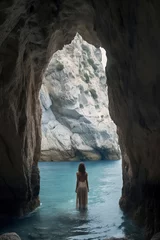 Papier Peint photo Cathedral Cove A woman stands in water inside a cave, gazing at the illuminated rocky opening leading to the open sea, ai generative