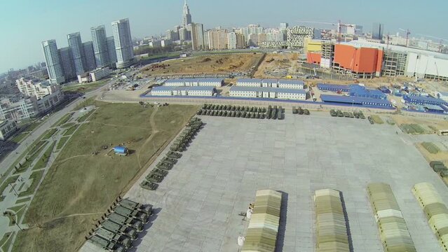 Cityscape with military base with machines for Victory Day Parade