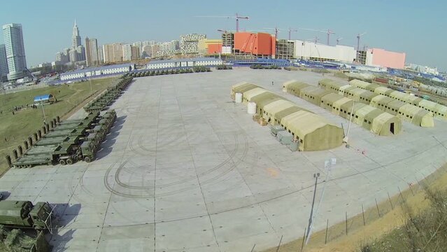 Base with military tents and machines for Victory Day Parade