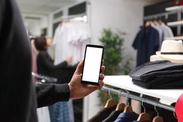 Clothing store client showing smartphone blank white screen mockup for boutique application...