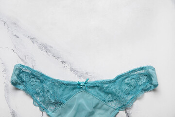 Lace female panties on light background