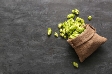 Sack bag with fresh green hops on black background