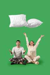 Young couple throwing pillows on green background