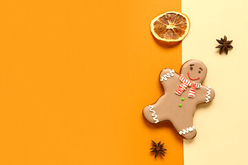 Christmas sweet gingerbread cookie with star anise and dried orange on colorful background