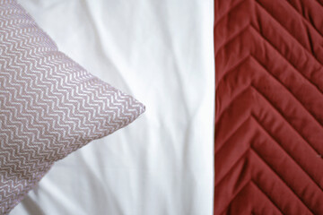 red and white silk. red and white fabric. home bed with pillow and pattern texture. comfort...
