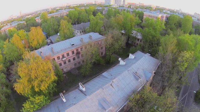 Old houses in style of constructivism at spring evening 