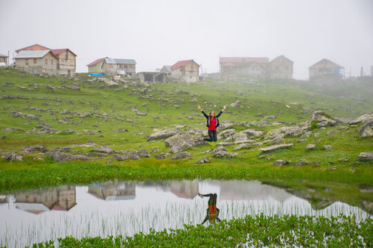 Young girl bouncing by the pond in Koçdüzü Plateau.