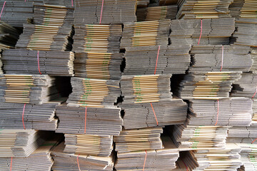 Stacks of cardboard boxes in a sweet potato packaging base in North China
