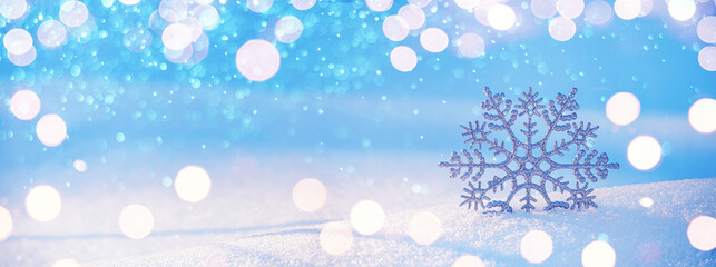Christmas winter background, banner - view of decorative snowflake in sparkling snow, copy space for text