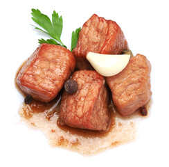 Pieces of delicious cooked beef, parsley, garlic and peppercorns isolated on white, top view. Tasty...