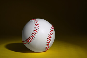One baseball ball on dark background. Space for text