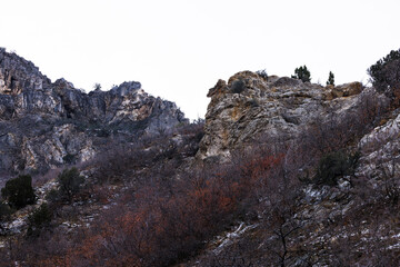 rocky precipice under white sky, slate canyon park, utah