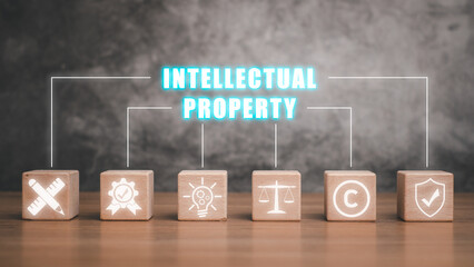 Intellectual property concept, Wooden block on desk with intellectual property icon on virtual...